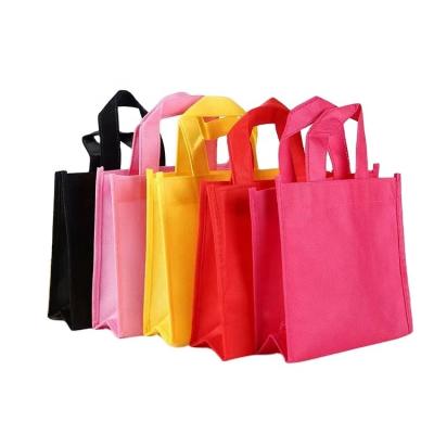 China Small Handled Recycled In Stock Non Woven Coloring Bags for sale