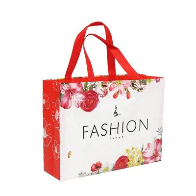 China Floral Handled PP Red Ultrasonic Matte Nonwoven Laminated Bags For Gifts Packing for sale