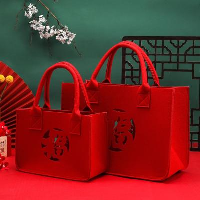 China Custom handled huahao printed logo christmas cartoon tote bag red felt new year for sale