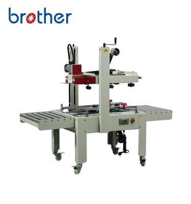 China Semi Automatic Food Brother FXJ6050 Milk Box Carton Case Adhesive Tape Sealing Carton Sealer Machine for sale