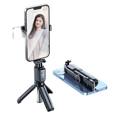 China Private Fold Design Integrated Detachable Mini Flexible Tripod Wireless Turner Selfie Light Stick for sale