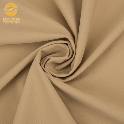 China Shuntian Stretch Customized Color 4 Way Stretch Plain Nylon Spandex Fabric For Tracksuit Sportswear for sale