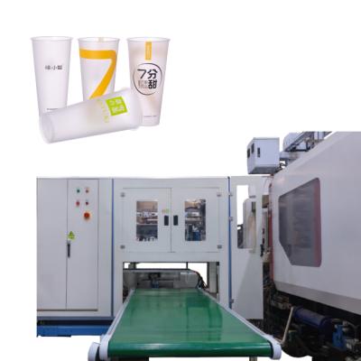 China Food System Side Entry High Speed ​​Type IML Robot Labeling Machine For Milk Tea Cup for sale