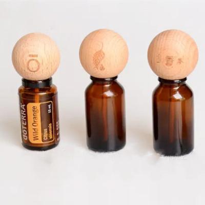 China Non Spill Wholesale Wooden Ball Silicone Sealed Aromatherapy Oil Bottle Stopper Perfume Balance Essential Oil Capsules for sale