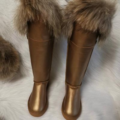 China 2019 custom made fluffy snow boot raccoon fur boot long waterproof brown leather snow boot christmas big size for sale