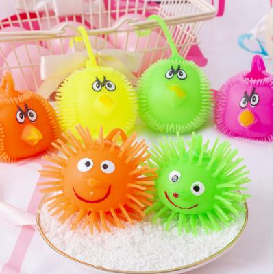 China Unzip Springball Smile Glowing Children's Silicone Hedgehog Toys Creative Cartoon Face Duct Toys for sale