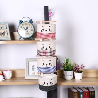 China Pen Rack Multi-Layer Cloth Wardrobe Cat Belle Hanging Storage Bag Cotton and Canvas Wall Hanging Storage Bag for sale