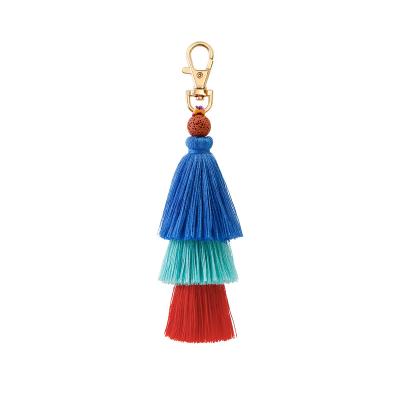 China Promotion Gift Boho Natural Stone Lava Stone Bag Charm Handbag Purse Tassel Chain Key Chain for sale