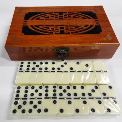 China Environmental Good Quality Domino Train Domino With Tin Box Indoor Wooden Domino Game for sale