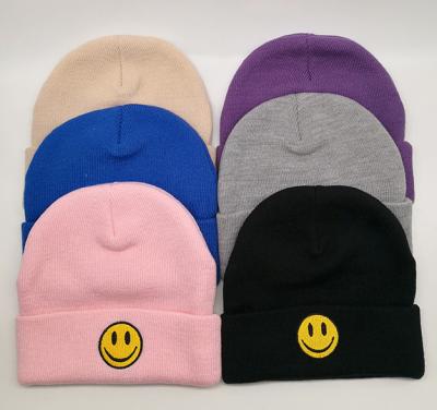 China Free Sample COMMON Wholesale Warm Unisex Acrylic Smile Face Winter Knitted Hats Simply Knit Beanie Hat for sale