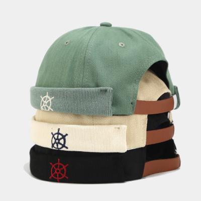 China breathable & Custom instock embroidery logo green label waterproof free shipping custom patch no brim wearing rolled cuff skull bowler hats brimless hat for sale