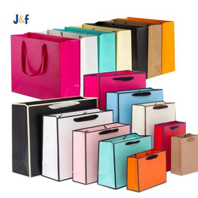 China Handmade large size luxury boutique packaging clothes color recycled custom paper bust personalizzate kraft paper bags with your own logo for sale