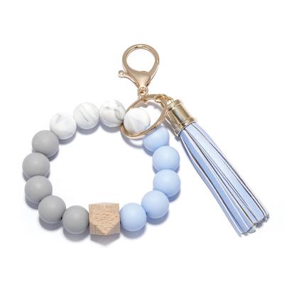 China Europe and America food grade silicone bead bracelet female key chain European and American PU tassel bracelet leather key chain for sale