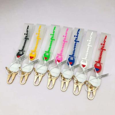 China Fashion Plastic Fabrics Brand Accessories High Quality Champion Clear Jelly PVC Short Lanyard KeyChain For Phone Camera Jeans Bag for sale