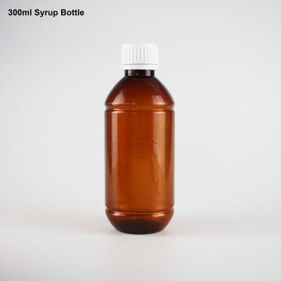 China PET Brown Color 300ml Pharmaceutical Plastic Liquid Medicine Bottle With Cap For Syrup for sale