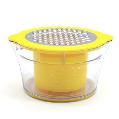 China Viable Multifunctional Household Kitchen Cutter Measuring Cup Fruit Hand Vegetable Squeezer for sale