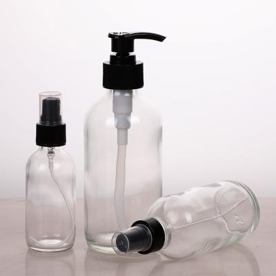 China 16oz Personal Care Customized Clear Round Glass Lotion Bottles With Reusable Trigger Spray for sale