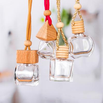 China New Home Decoration 5ml Car Air Freshener Car Hanging Perfume Bottle With Wooden Lids for sale