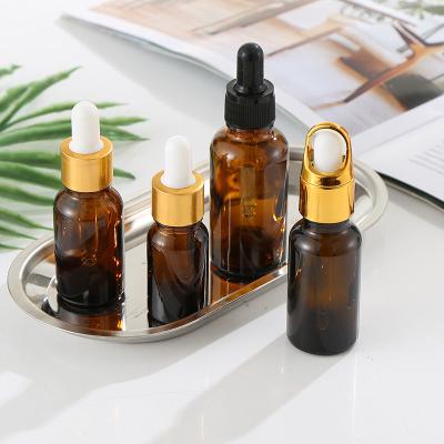 China Popular Glass Black Matte Bottle With Gold Dropper 4Oz Personal Care Essential Oil Dropper Bottle for sale