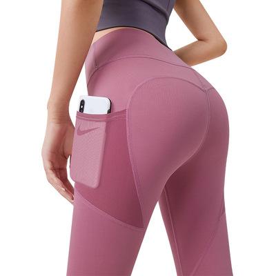 China 9 Point Hip Peach Sports Lifting Tights Gaiters High Waist Mesh Side Pocket Hip Traceless Breathable Elastic Seamless Yoga Gaiters for sale