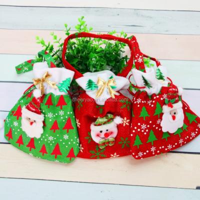 China Colorful Cheap Gift New Year Holiday Candy Bag Drawstring Christmas Gift Bag for sale