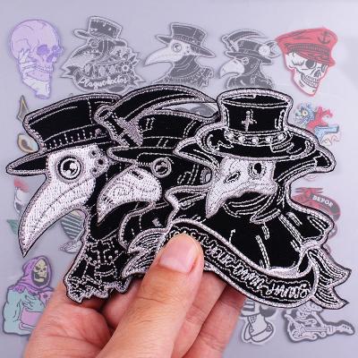 China Custom Black 3D Bird Logo Iron On Embroidered Hat Patch for sale