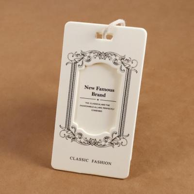 China Recyled Customized Size And Shape Paper Laser Cut Hang Tag Labels For Men's Clothing for sale