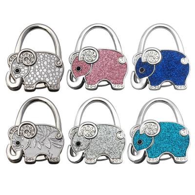 China Klappbare Elefant Taschenhalter Portable Metall Handtasche Haken für Tisch zu verkaufen