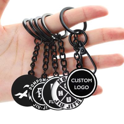 Cina Customized Key Rings Souvenirs Car Company Logo Key Chain Zinc Alloy Black White Keychain in vendita