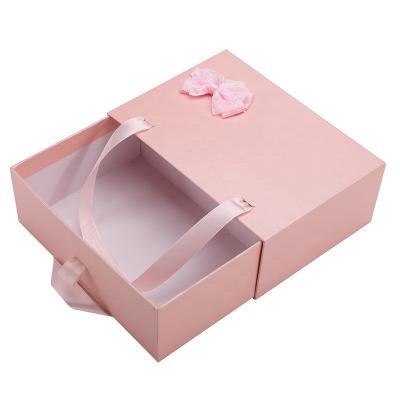 China Single & Custom Pink Glitter Surprise Gift Cosmetic Bowknot Packaging Drawer Paper Box for sale